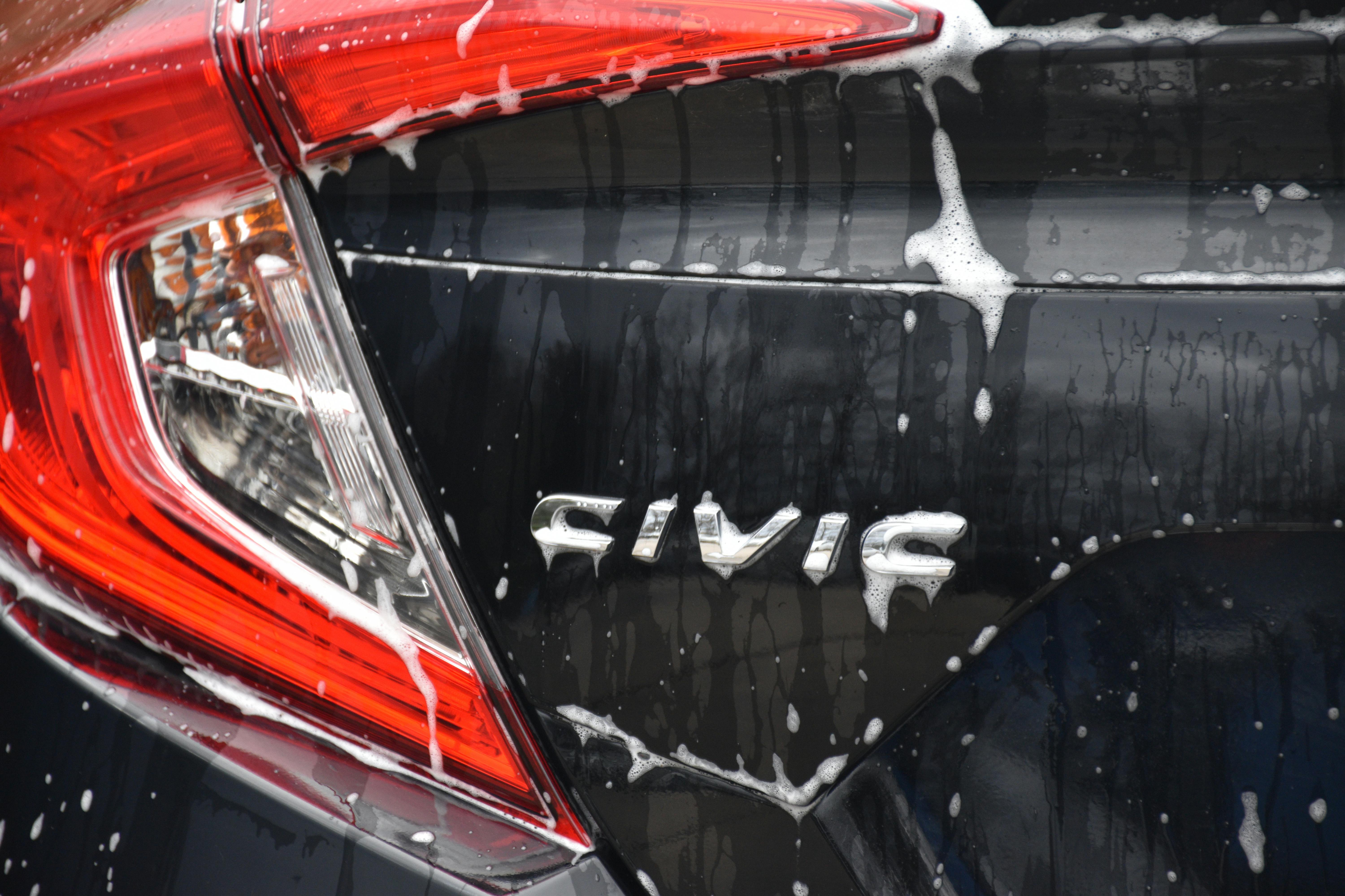 Older woman using light dumbbells in a living room workout