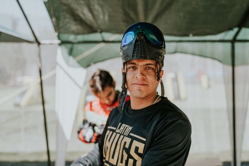 Free Close-up of a paintball player in protective gear outdoors, ready for action. Stock Photo