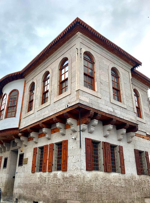 Free Low angle view of a traditional Ottoman style building with arched windows and ornate architecture. Stock Photo