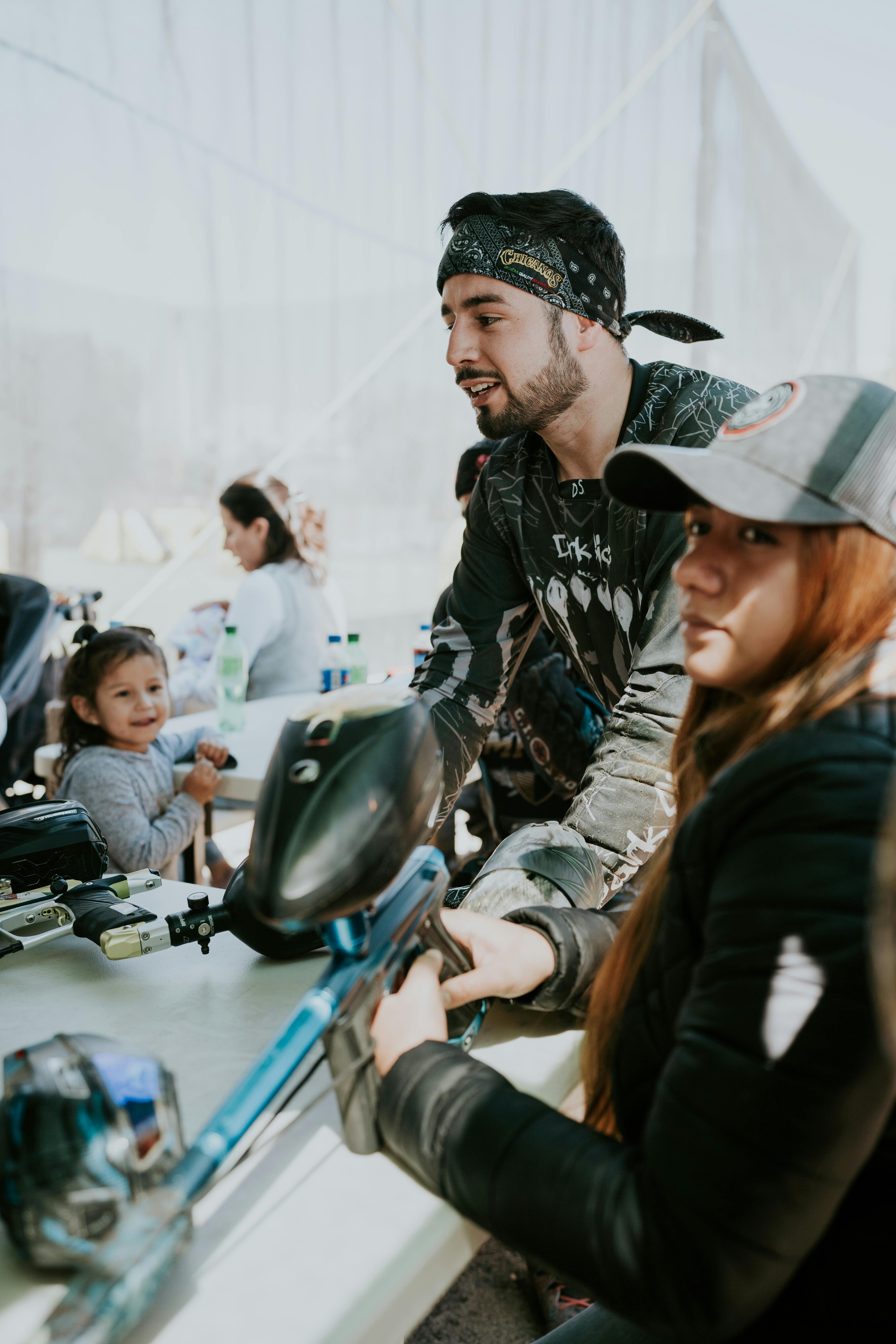 Team enjoying paintball activity outdoors. Gear and strategy on display. Prescription Goggle Inserts - Team enjoying paintball activity outdoors. Gear and strategy on display.