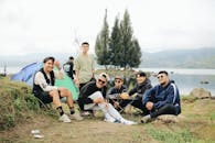 Smiling Men Posing with Island behind