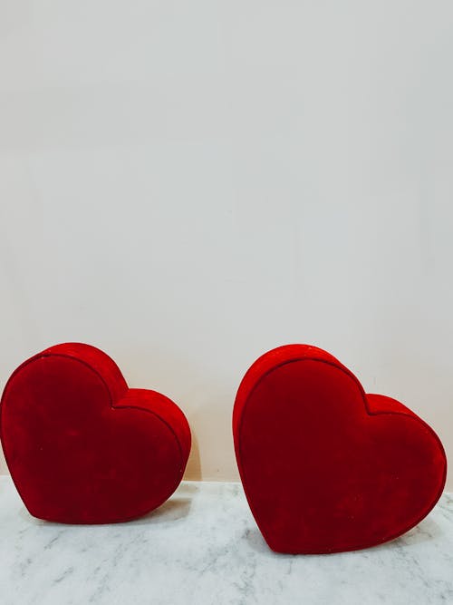 Two Red Hearts on a White Background