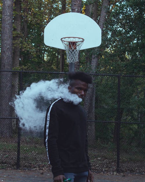 Free Man Blowing Smoke Stock Photo