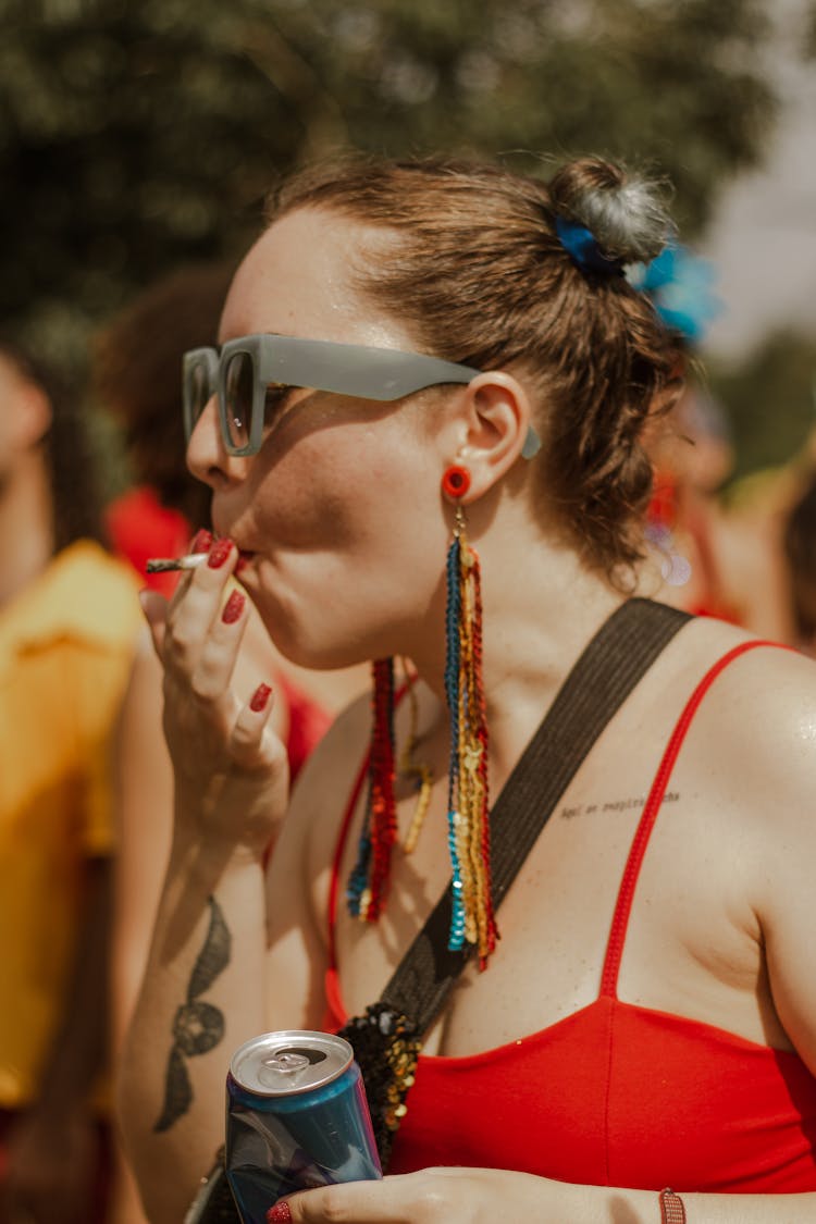 Woman In Sunglasses Smoking