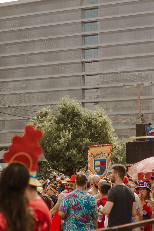 Free A lively urban scene featuring a colorful parade and enthusiastic crowd enjoying a festival. Stock Photo