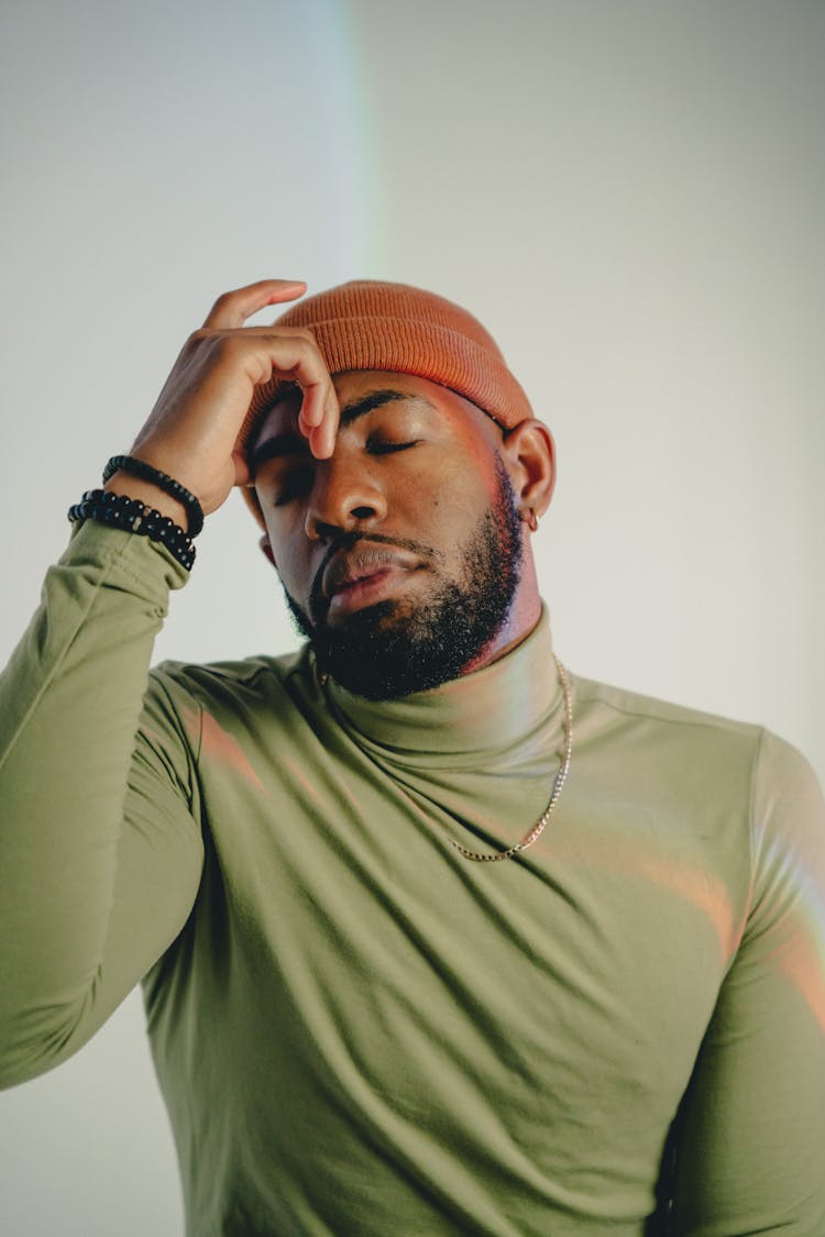 Bearded Man In Beanie Hat Posing In Studio