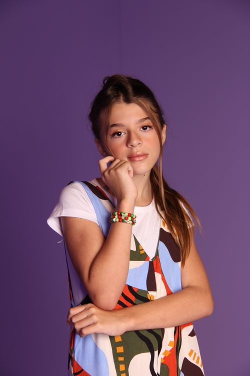 Portrait of a Young Girl on a Purple Background · Free Stock Photo