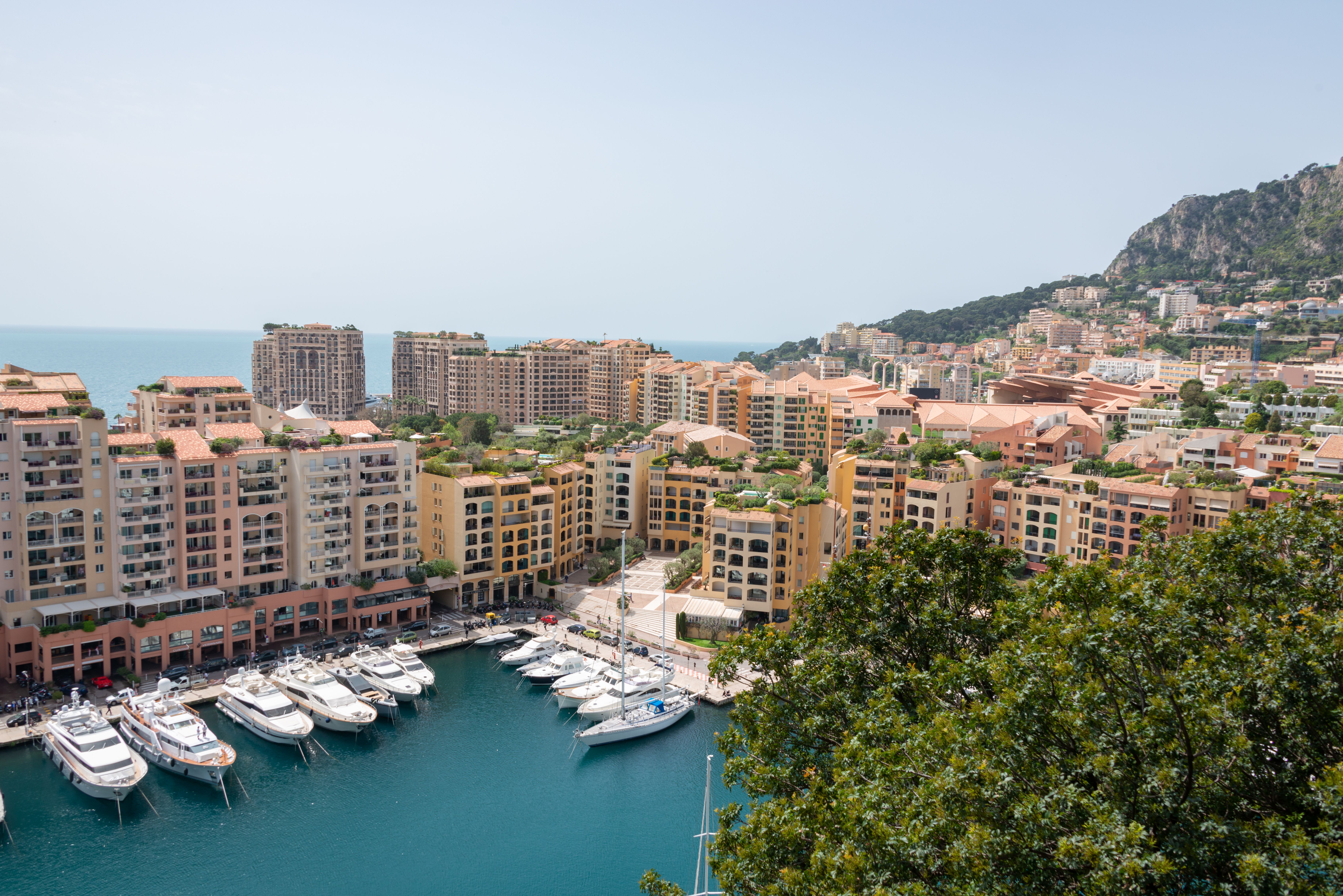 Amazing Monaco Private Yacht Rental with Skipper Review: Your Ultimate Riviera Experience Review 2026 - Aerial view of luxury yachts and urban landscape in Monaco harbor.