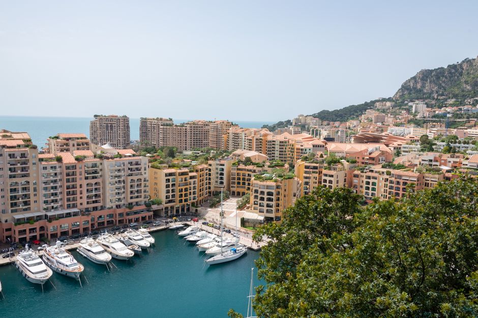 Amazing Monaco Private Yacht Rental with Skipper Review: Your Ultimate Riviera Experience Review 2026 - Aerial view of luxury yachts and urban landscape in Monaco harbor.