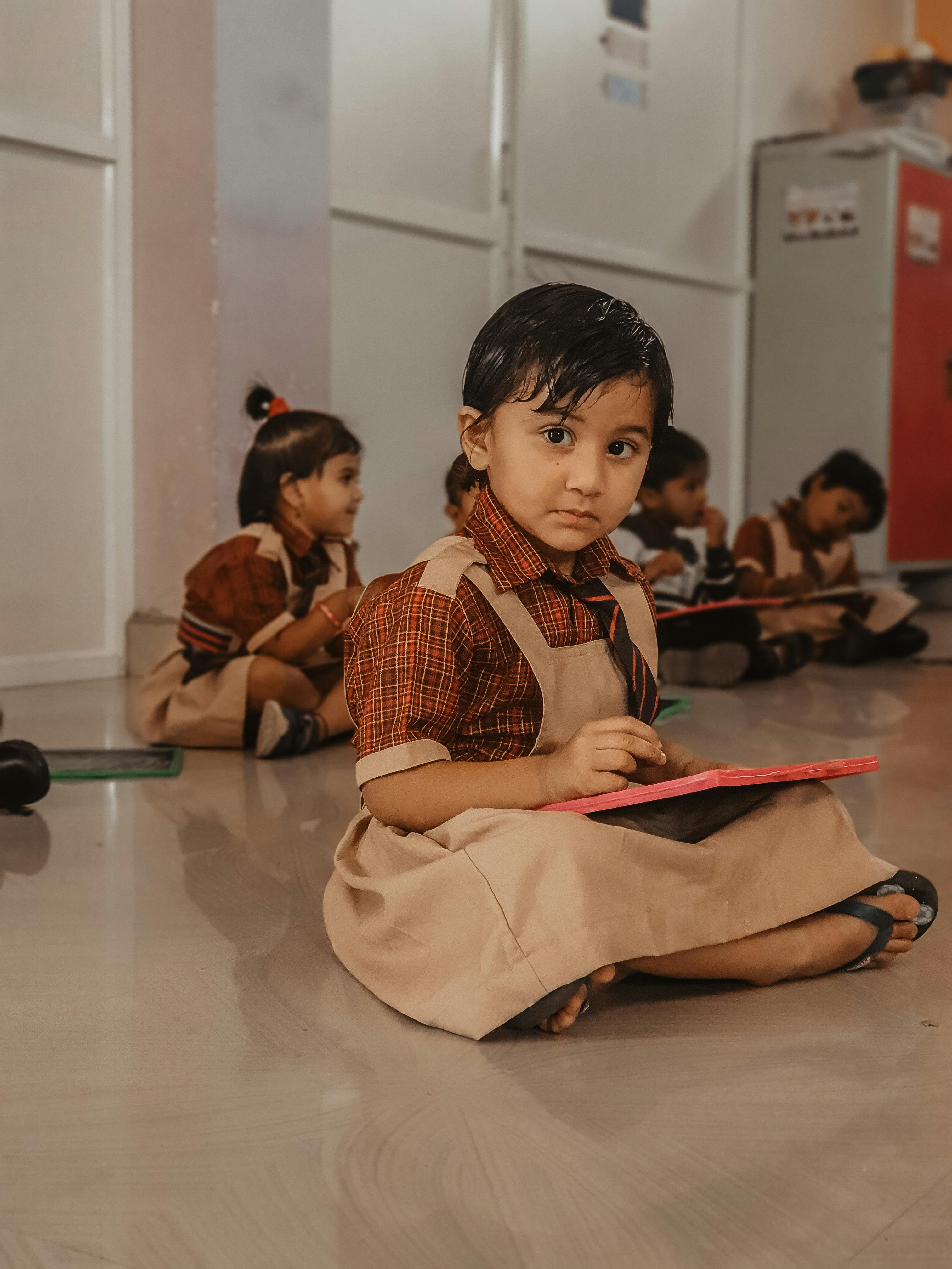 student sitting on the floor