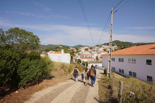 Group of People Walking on Road