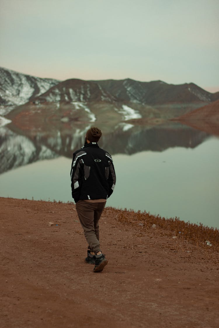 Man Hiking By Lake