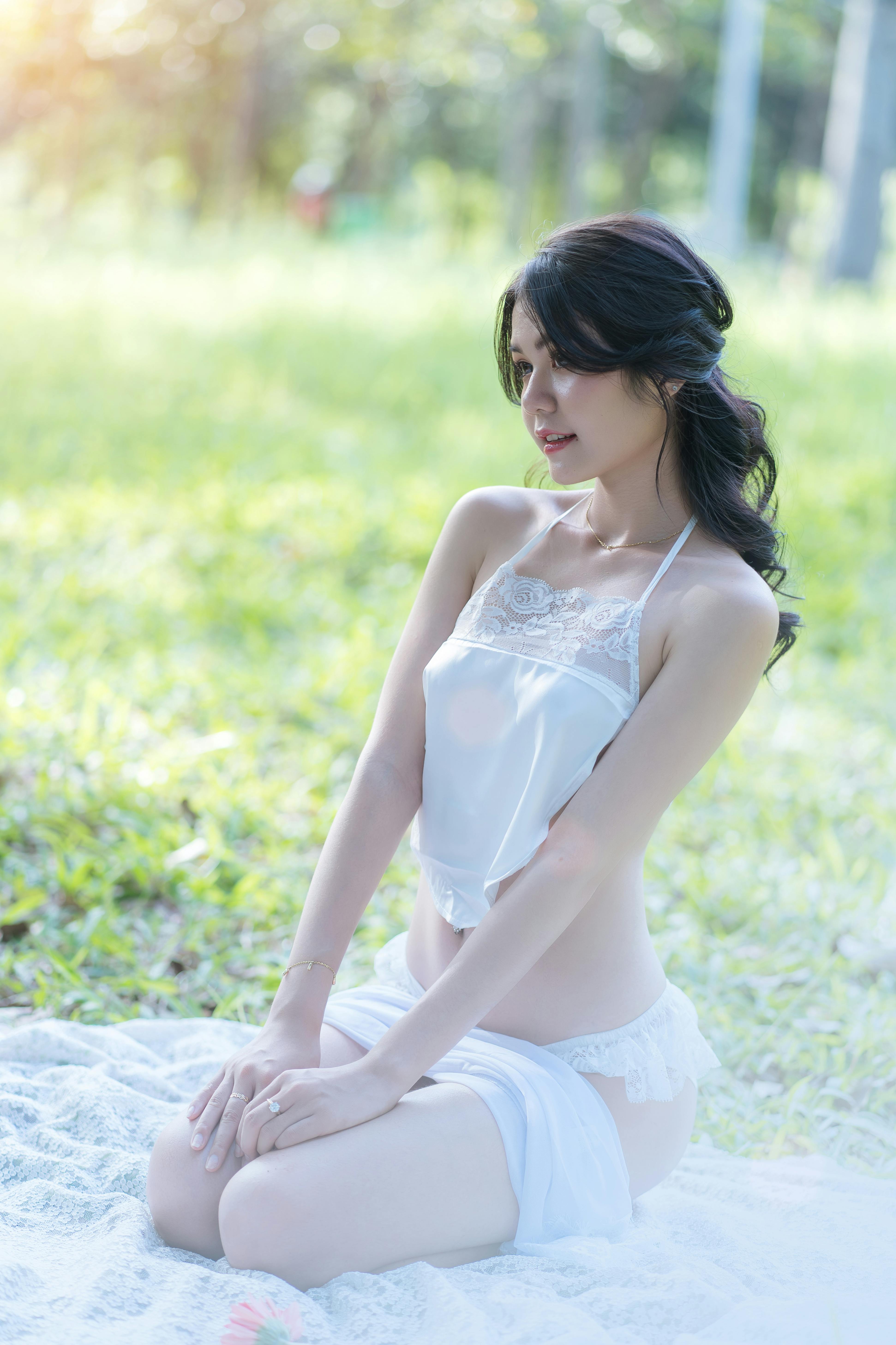 Brunette Woman in Lingerie Sitting at Picnic · Free Stock Photo