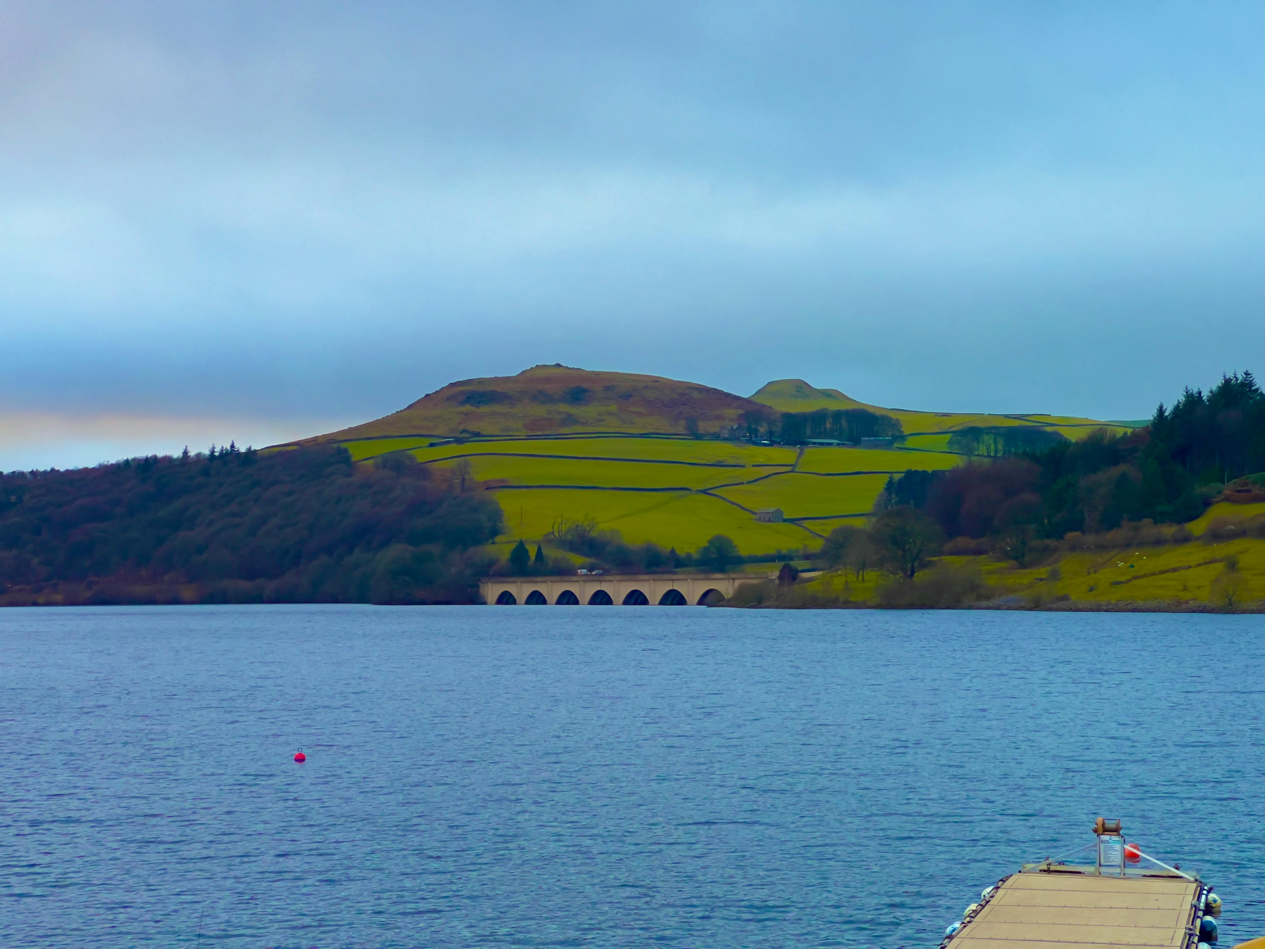 Cycling gear on a table alongside a bowl of healthy food and fruit