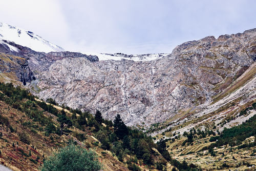 Free Breathtaking view of a mountainous landscape, featuring rocky slopes and green valleys. Stock Photo
