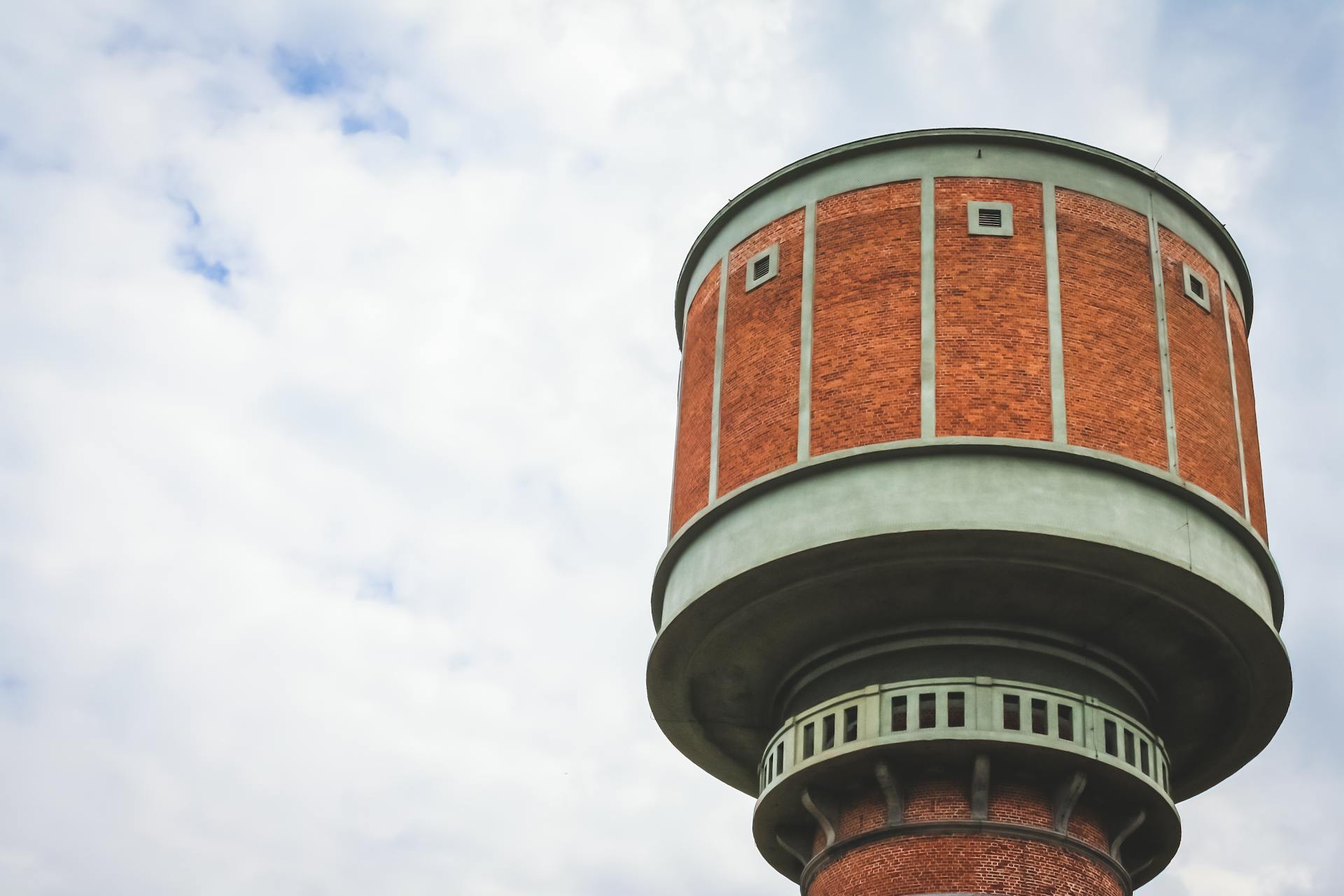 Brick Tower Against Cloudy Sky