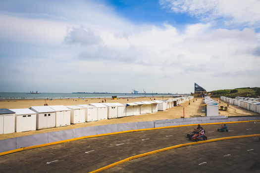 People Riding Bikes on Track Near Beach