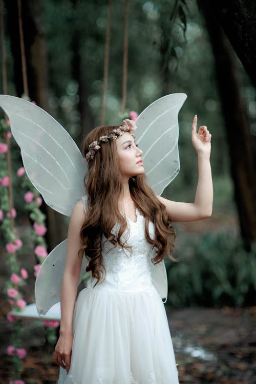Woman in Fairy Costume Raising Hand
