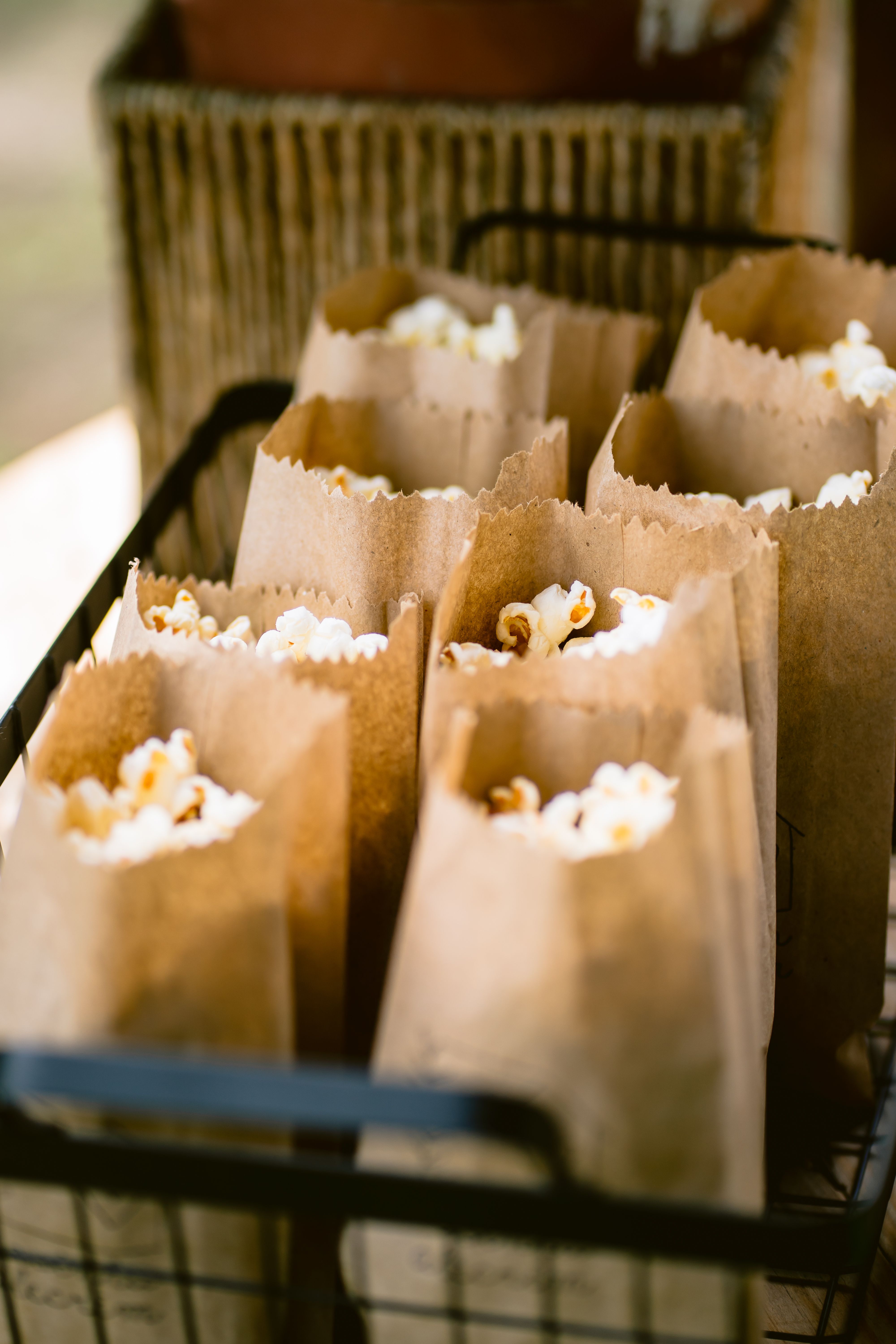 Popcorn in paper bag on film reel free stock photo