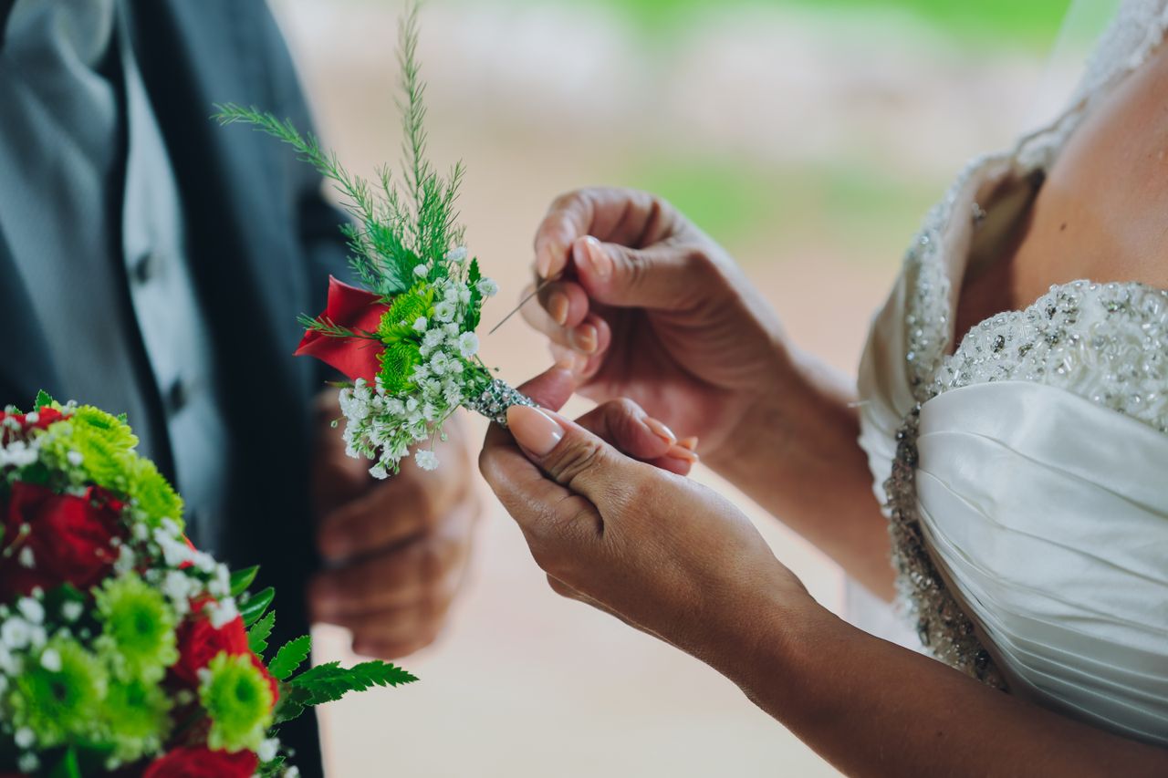 close up of a bride and groom s hands during a wedding ceremony with b