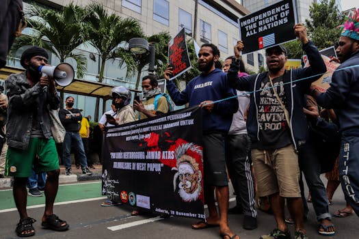 Protesters in Jakarta advocate for West Papua independence, holding banners and signs.