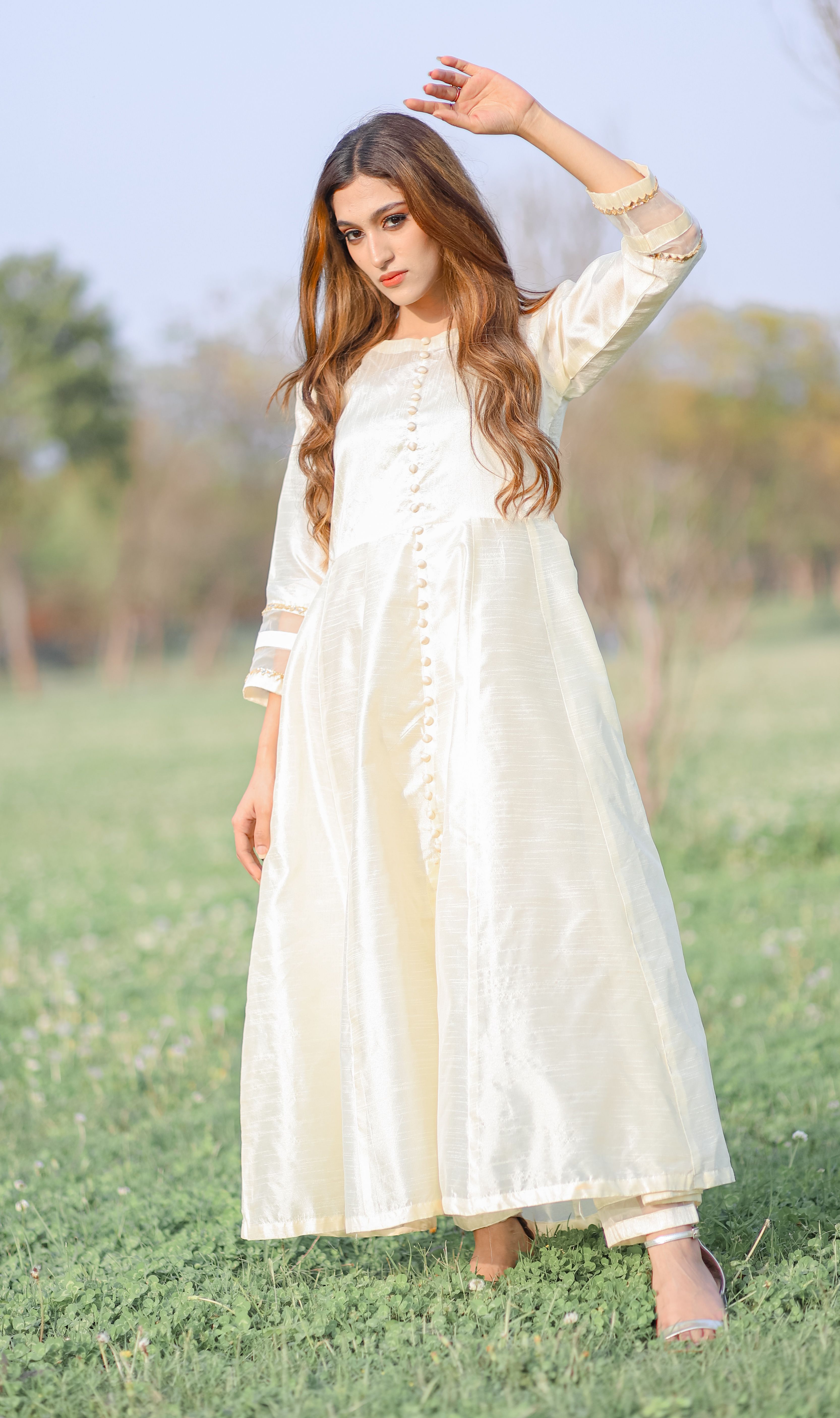 Woman in White Dress Standing with Arm Raised on Meadow · Free Stock Photo