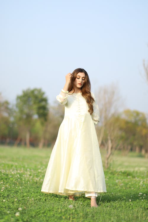 Model in White Dress on Meadow