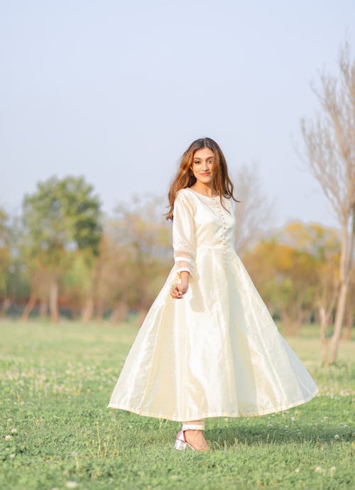 Model in White Dress on Meadow