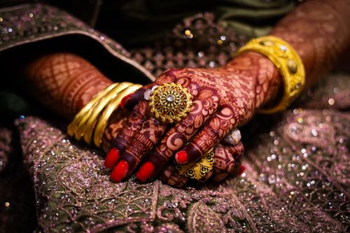 Free Close-up of beautifully hennaed hands with ornate jewelry, showcasing traditional culture in Srinagar. Stock Photo