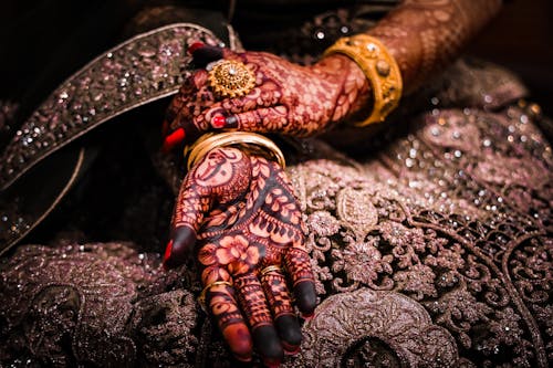 Close-up of Woman Hands in Traditional Mehndi Drawings
