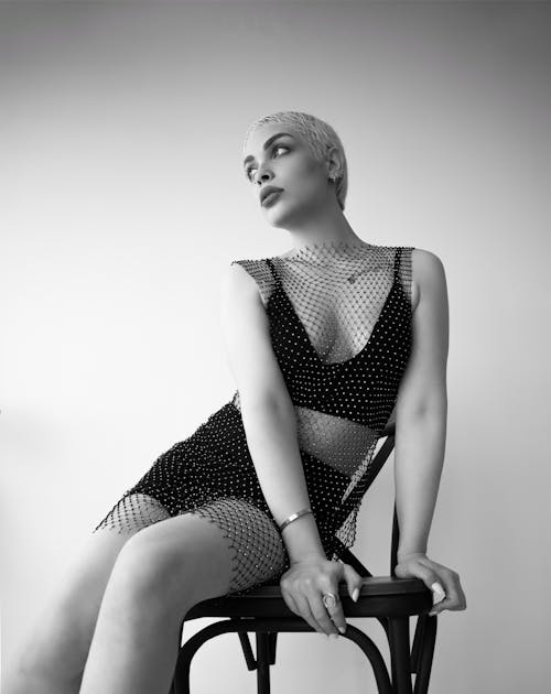 Woman Sitting on Chair in Black and White