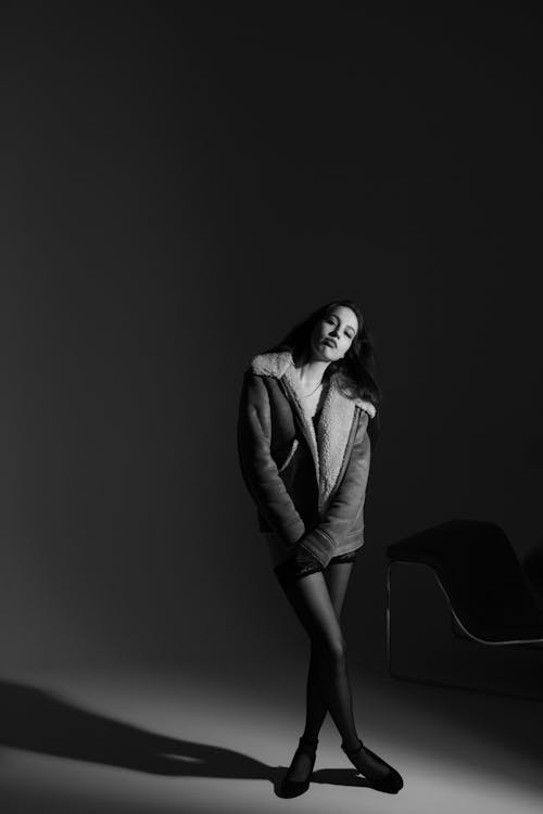 Female Model Wearing a Warm Jacket Posing in the Studio