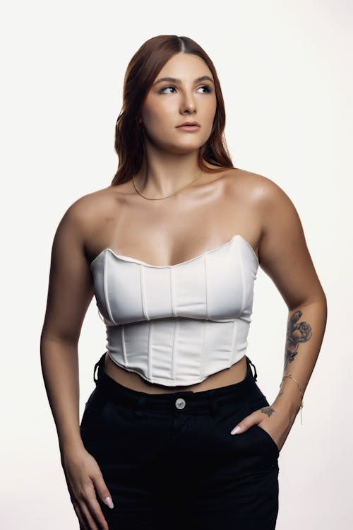 https://images.pexels.com/photos/15462138/pexels-photo-15462138/free-photo-of-woman-in-corset-posing-in-studio.jpeg?auto=compress&cs=tinysrgb&dpr=1&w=500