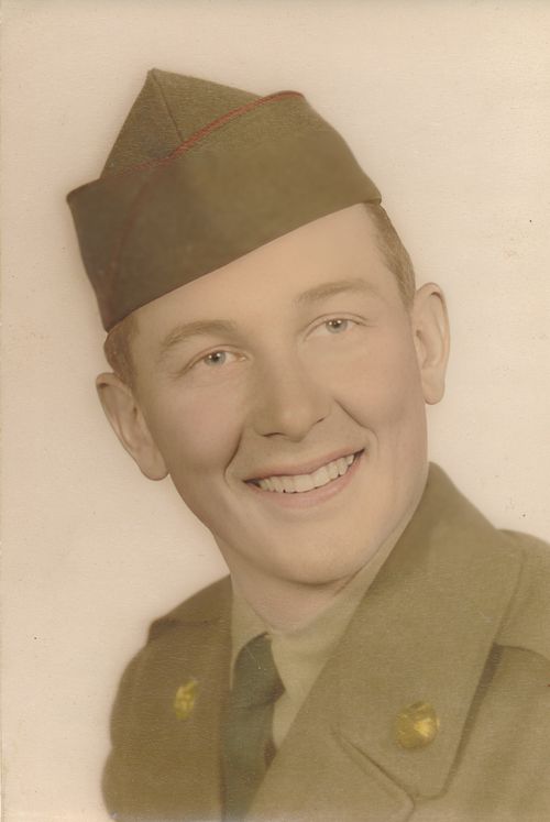 Free A classic sepia portrait of a smiling soldier in military uniform wearing a hat. Stock Photo