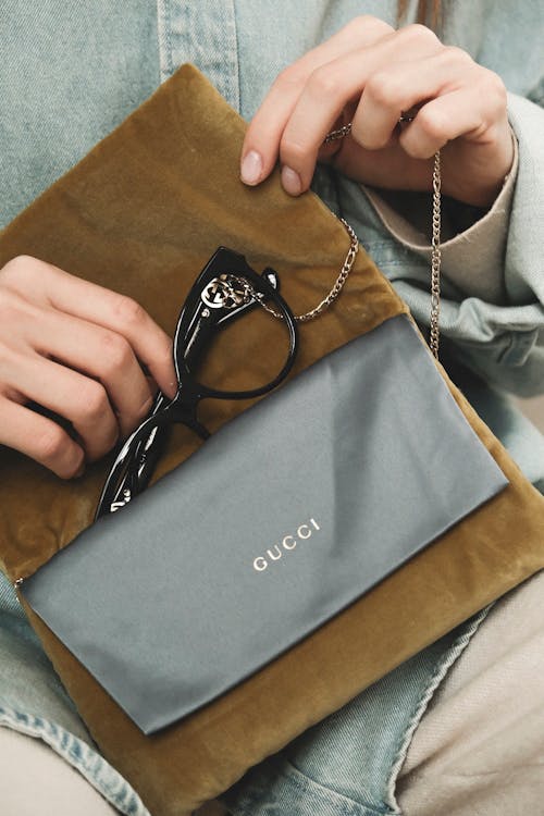 Close-up of Woman Putting the Glasses into a Case 
