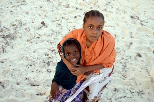 Girls Posing Together on Sand