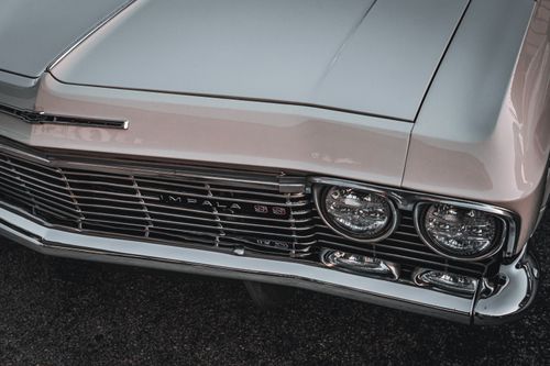 Free High angle close-up of a vintage Chevrolet Impala SS in silver livery showcasing its iconic design. Stock Photo
