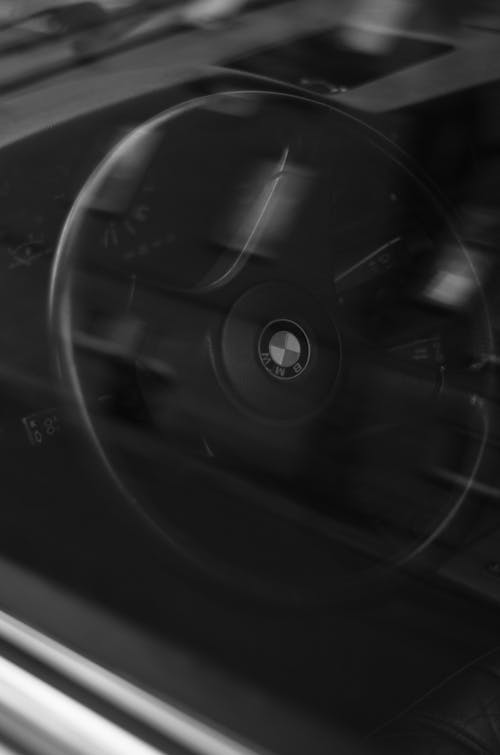 BMW Steering Wheel behind Window in Black and White