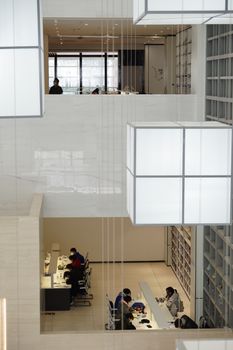 Contemporary office space featuring open work environments and modern design elements.