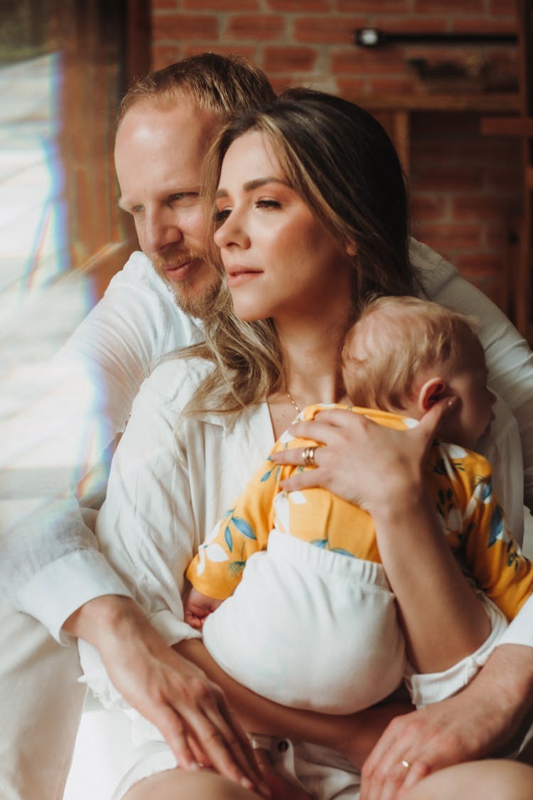 Photo Of A Couple With A Baby