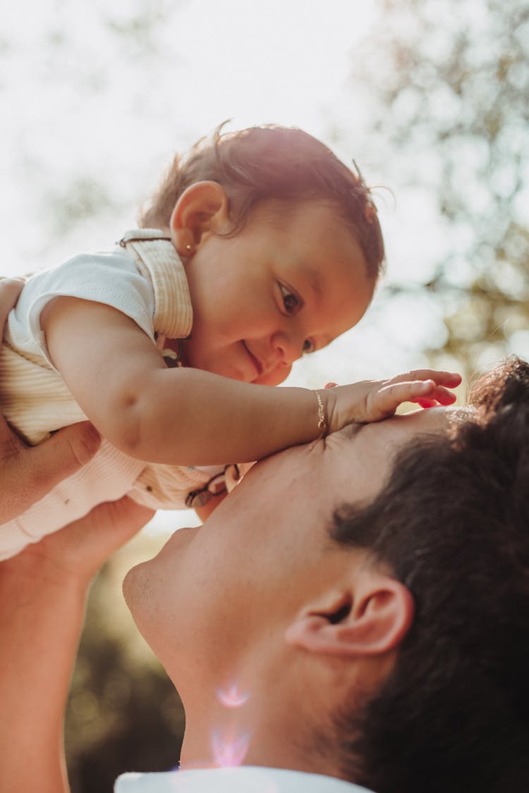 Photo Of A Man With A Baby