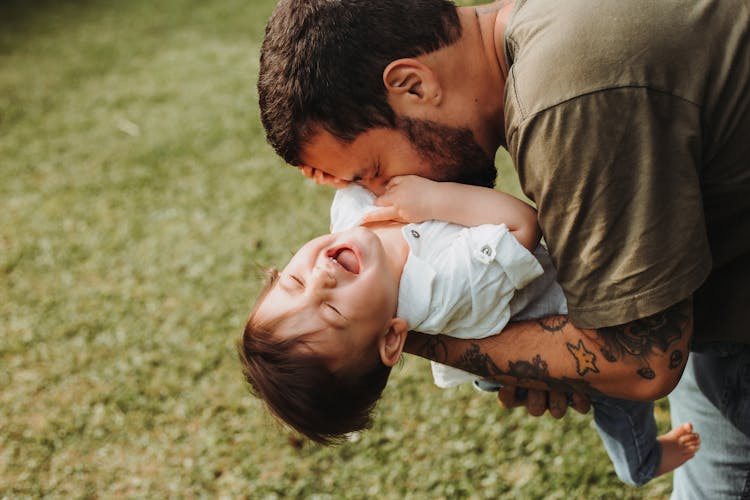 Photo Of A Father Playing With A Child