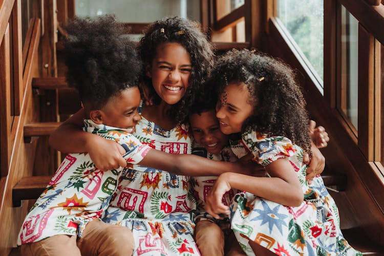 Photo Of Children In Similar Clothes Hugging