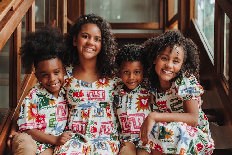 Portrait Of Children Wearing Similar Clothes