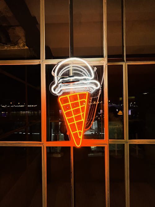 Neon Ice Cream Sign on Glass Wall