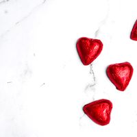 Red heart-shaped sweets, photo by Studio Naae on Pexels