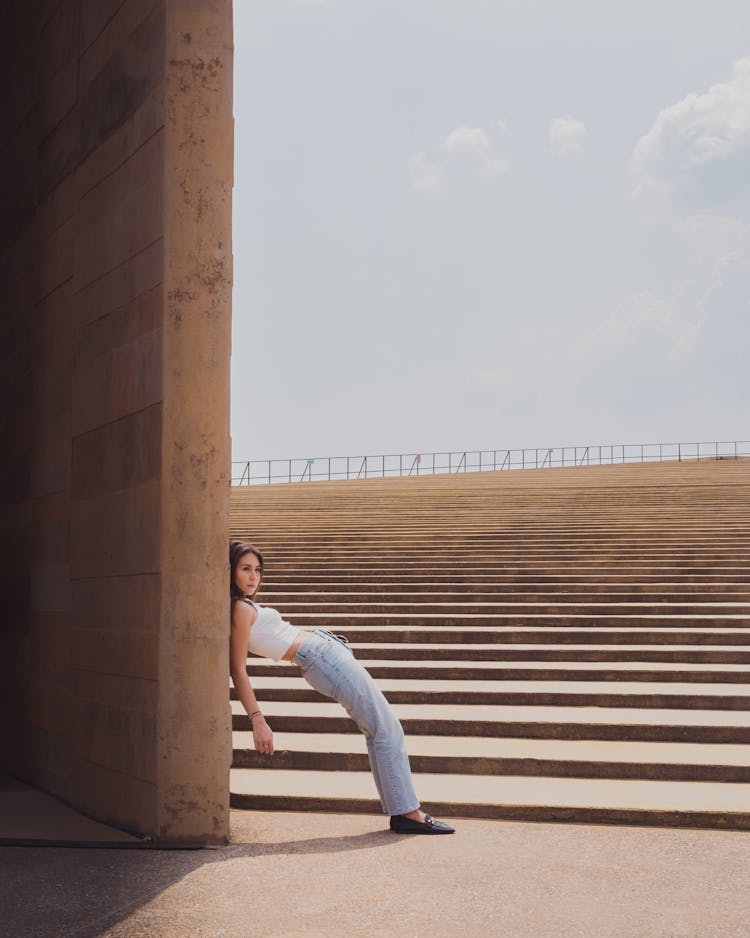 Beautiful Young Woman Leaning On A Wall