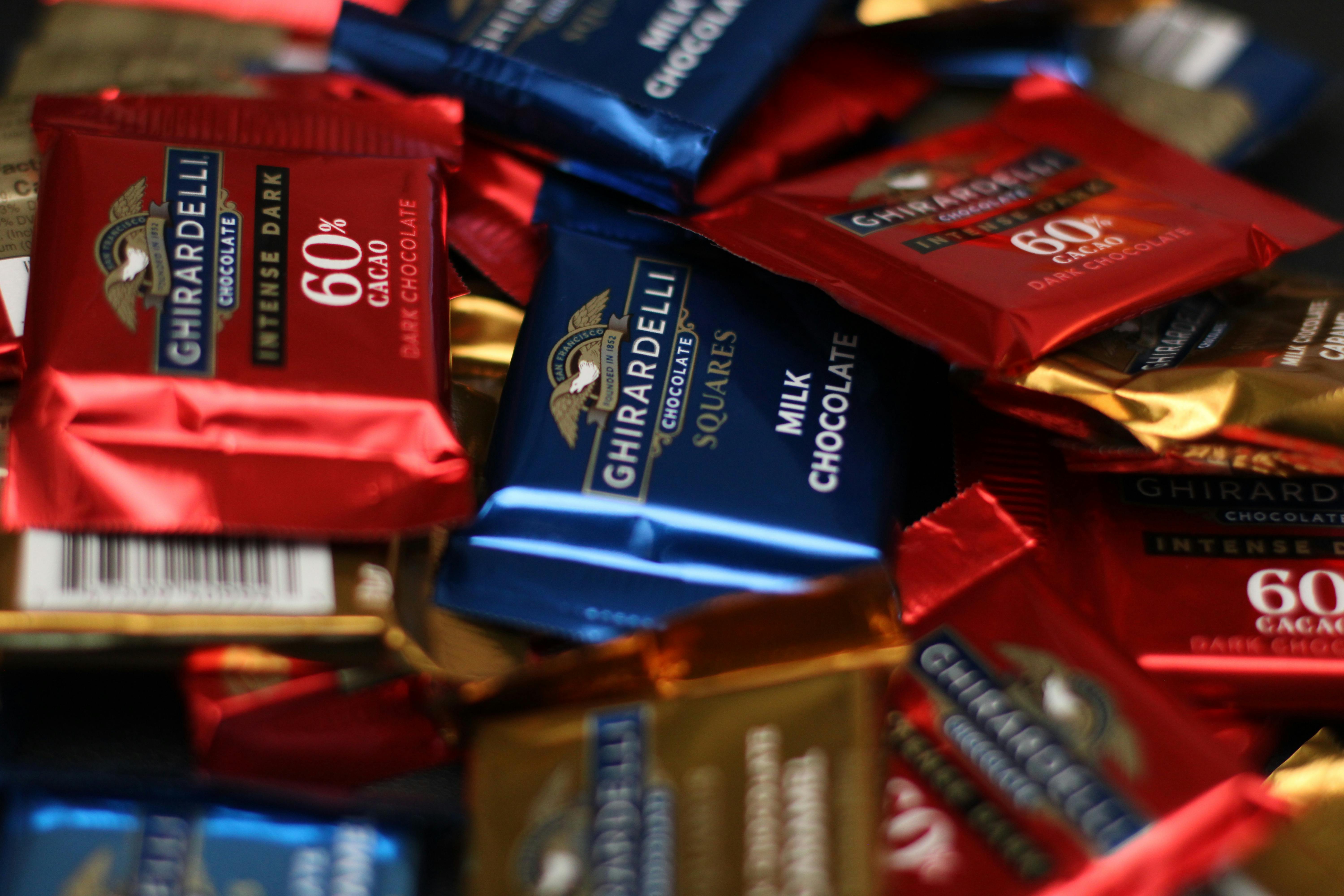 a pile of chocolate bars with different colors