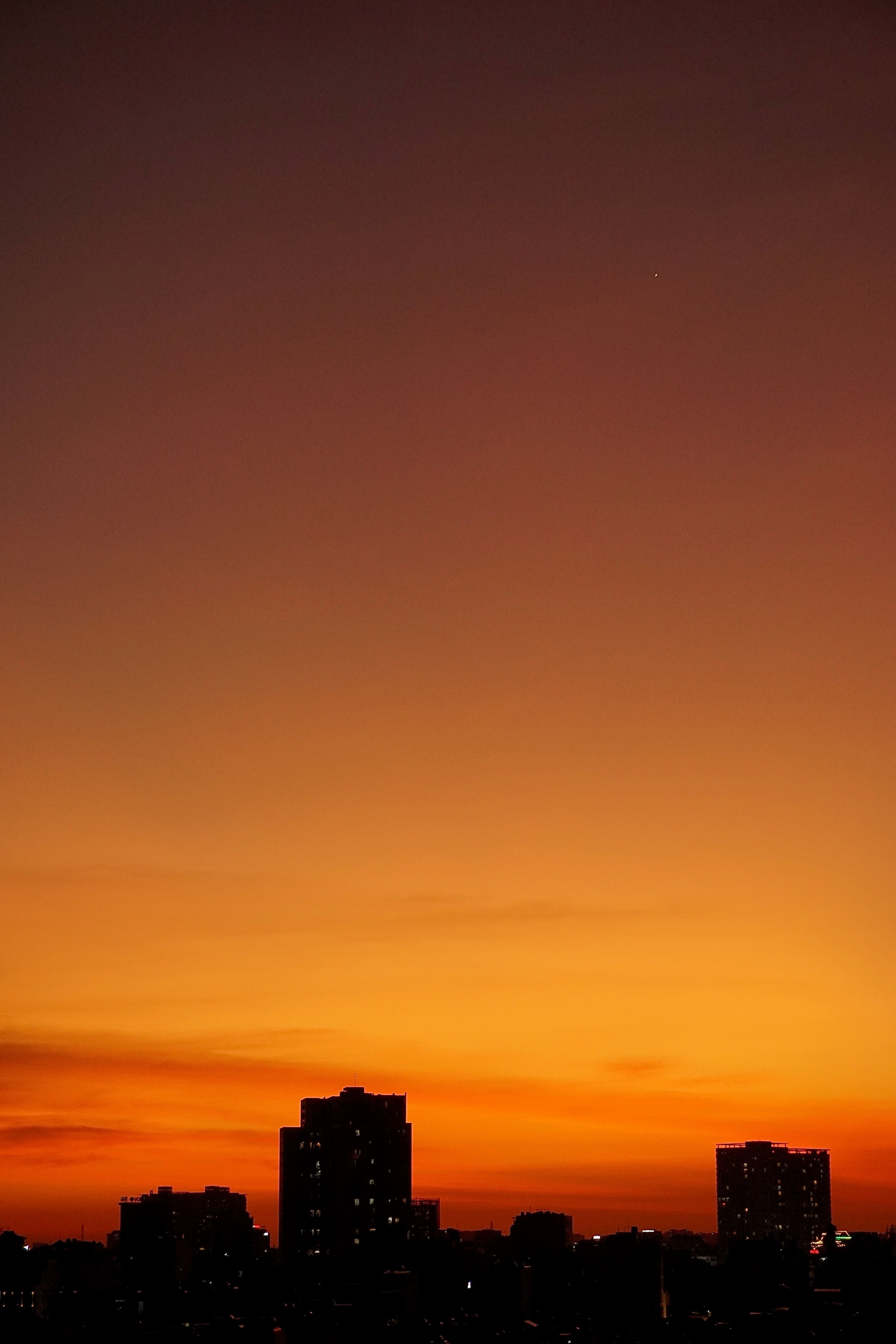 Yellow Sky over City at Sunset · Free Stock Photo