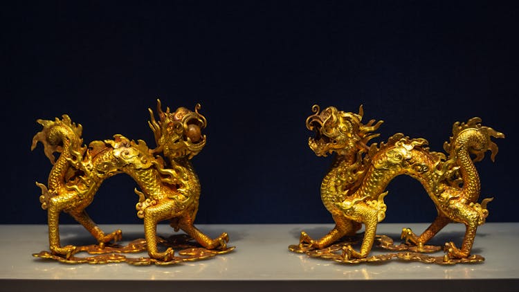 Gold Figurines Of Chinese Dragons